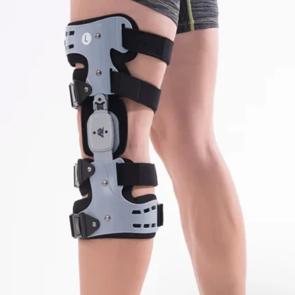 FitMax OA Knee Brace worn on the left knee, front view with grey shells, side hinge and four straps