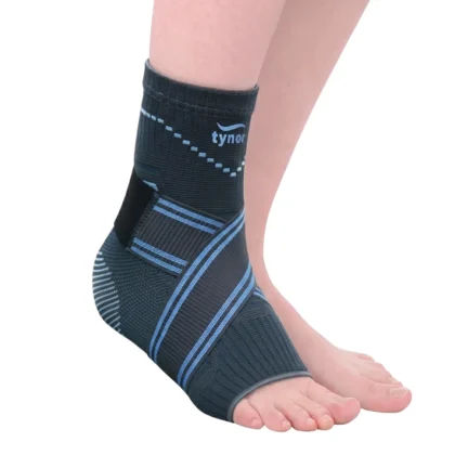Tynor Ankle Binder in dark grey with blue stripes worn on the foot, showing the binder strap crossing the instep