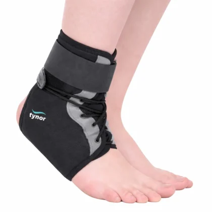 Tynor Ankle Brace in black and grey worn on the foot, showing the laces, side panel and wrap strap