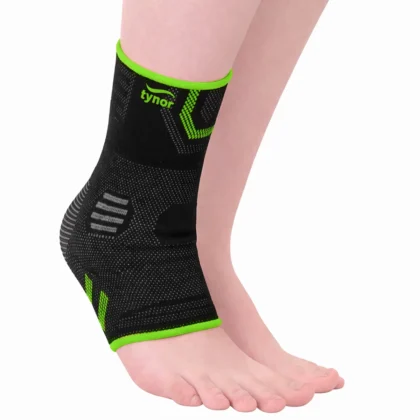 Tynor Ankle Support Air Pro in black and green worn on the ankle, with green edges and grey knit panels