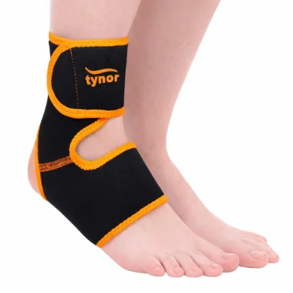 Black and orange Tynor Ankle Support (Neo) wrapped around the ankle, side view with the open heel and toes