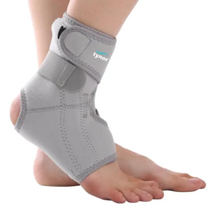 Tynor Ankle Support (Neoprene) in grey, worn on the ankle, side view