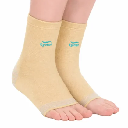 Pair of Tynor Anklets in beige worn on both feet, open at the toes, with a striped knit heel