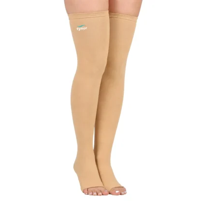 Tynor Compression Stocking Mid Thigh Classic in beige worn on both legs up to the mid-thigh, open toes