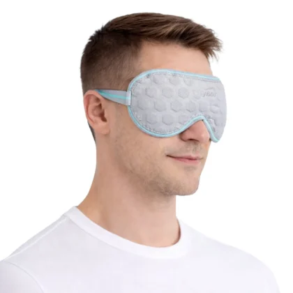 Man wearing the Tynor Eye Cool Pack, a grey gel eye mask with an elastic strap