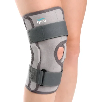Tynor Functional Knee Support worn on the knee, front view with two straps, open kneecap and side splints