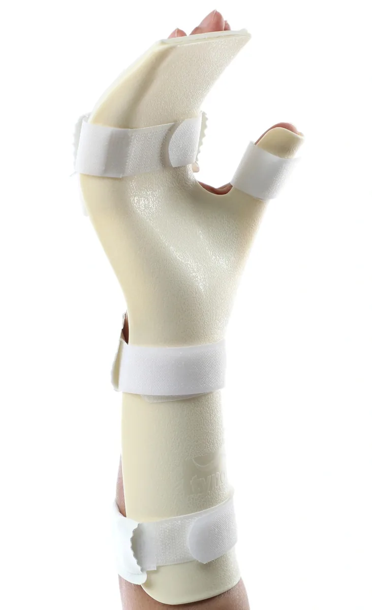 Tynor Hand Resting Splint in beige worn on the hand and forearm with white straps