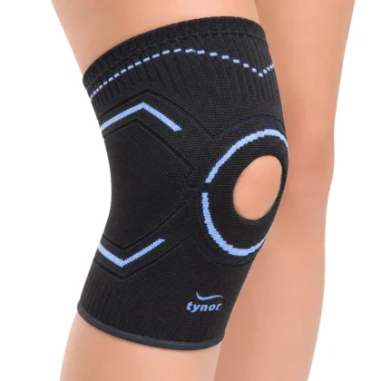 Tynor Knee Cap Open Patella worn on the knee, showing the open kneecap with its ring and the patterned knit
