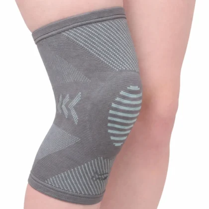 Tynor Knee Cap With Patellar Ring in grey knit worn on the knee, front view showing the ring pattern and side panels