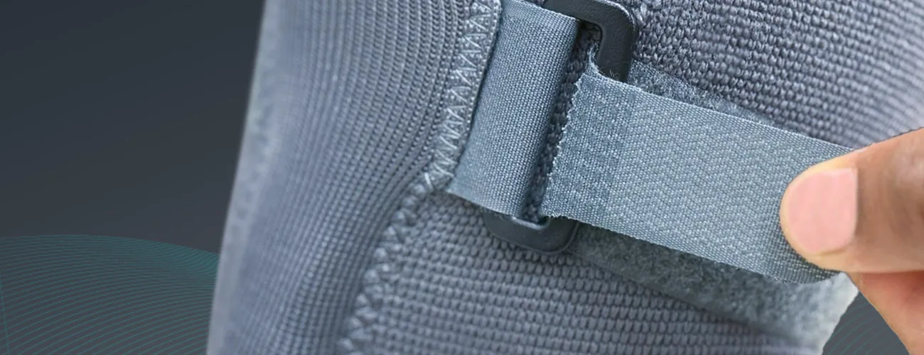Tynor Knee Cap With Rigid Hinge close-up: hook-and-loop strap