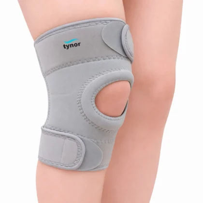 Tynor Knee Support Sportif (Neoprene) in grey on the knee, with an open padded kneecap ring and straps