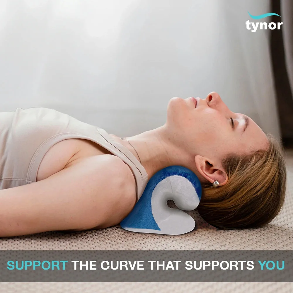 Woman lying on her back with the Tynor Neck Corrector & Relaxer under her neck