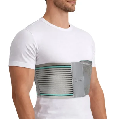 Man in a white T-shirt wearing the grey Tynor Rib Belt with teal stripes around the lower chest