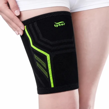 Tynor Thigh Support Air Pro in black and green, worn on the thigh