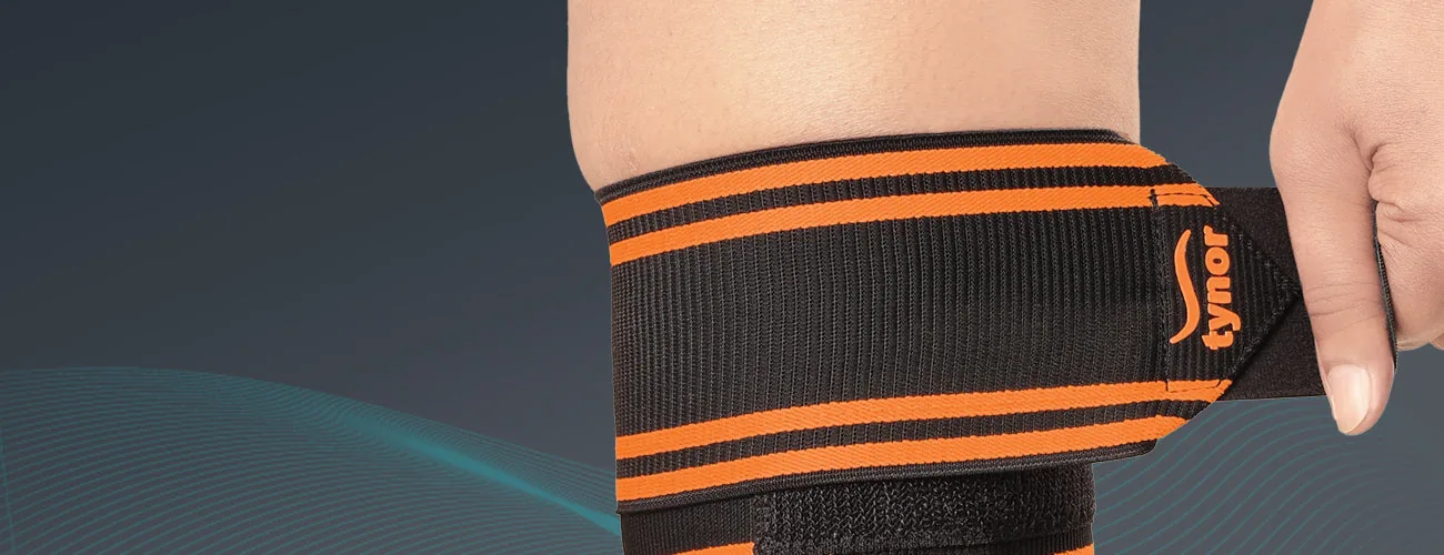 Tynor Weight Lifting Knee Wrap close-up: hook-loop end tab
