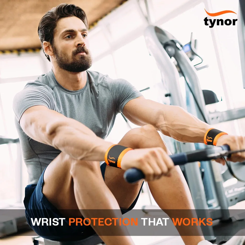 Man on a rowing machine in a gym, wearing the Tynor Wrist Support (Neo) on both wrists