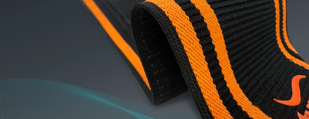 Tynor Wrist Wrap With Thumb Loop close-up: elastic weave and stripes